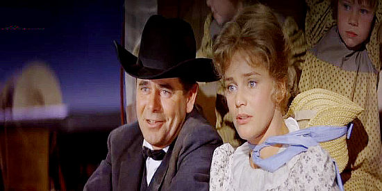 Glenn Ford as Yancey Cravet and Maria Schell as Sabra Cravet, reacting to Dixie's appearance at the land rush in Cimarron (1960)