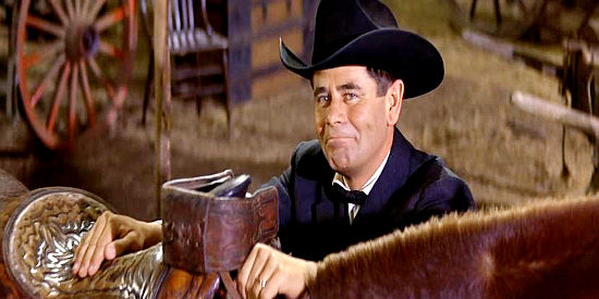 Glenn Ford as Yancey Cravet, ready to mount up for the land rush in Cimarron (1960)