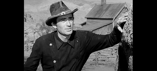 Gregory Peck as Stretch, trying to negotiate with Mike and her grandpa in Yellow Sky (1948)