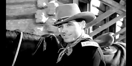 Guy Madison as Larry Knight, an engaged man letting his interest stray in Massacre River (1949)