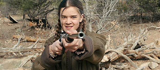 Hailee Steinfild as Matt Ross, holding the man she's been seeking at gunpoint in True Grit (2010)