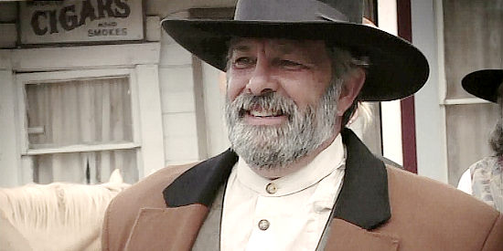 Hank Sinatra as Everett Cates, a man in danger of losing his land to Mortimer's bank in Hell's Fury (2009)