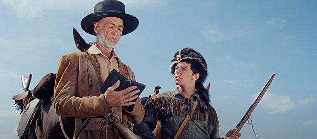 Hank Worden as Parson gives thanks for finding the Alamo while Smitty (Frankie Avalon) looks on in The Alamo (1960)