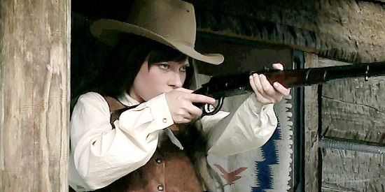 Hannah Hague as Eryn Cates, spotting trouble riding her way in Hell's Fury (2009)