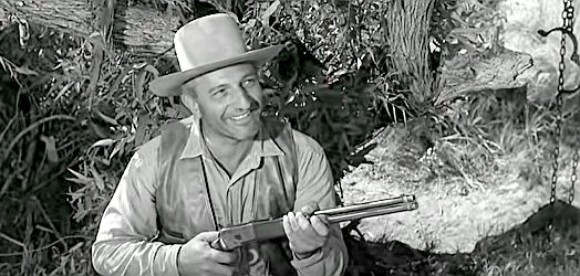 Harold Stone as Lavelle, warning Chris Foster that his options are $12,000 in bonds or a dead friend in Showdown (1963)