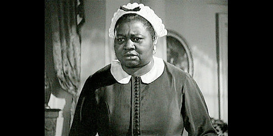 Hattie McDaniel as Callie, Elizabeth Bacon's maid, surprised by her interest in onions in They Died with Their Boots On (1941)