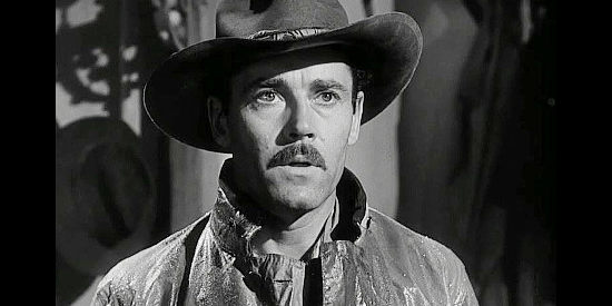 Henry Fonda as Wyatt Earp, coming face to face with the rain-soaked Clanton clan after his brother's death in My Darling Clementine (1946)