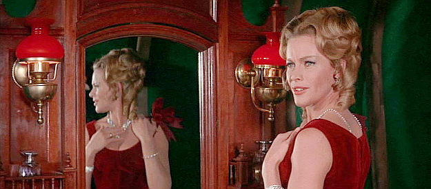 Honor Blackman as Julia Daggett, trying to arrange a marriage between Baron Von Hallstatt and Countess Irina in Shalako (1968)