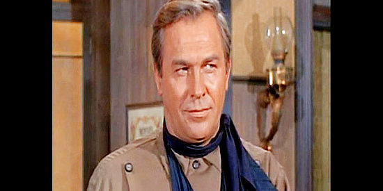 Howard Keel as Lee Travers, a riverboat gambler turned Confederate turned lawman in Arizona Bushwhackers (1968)