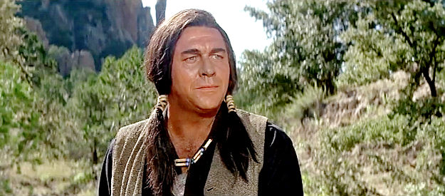 Howard Keel as Levi Walking Bear, the partner who helps Taw Jackson negotiate with the Indians in The War Wagon (1967)