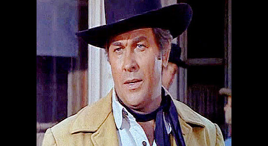 Howard Keel as Waco, arriving in Emporia to clean up the town on a government pardon in Waco (1966)