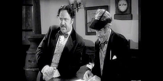Hugo Hass as Marko Poli, dictating a telegram to be sent to his estranged daughter in Dakota (1945)