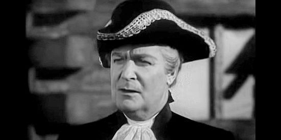 Huntley Gordon as John Randolph, father of Virginia and Jerry, leading them West in Daniel Boone (1936)