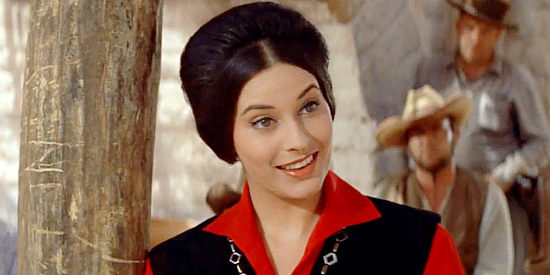 Ina Balin as Pilar Graile, meeting Paul Regret again in the comancheros camp in The Comancheros (1961)