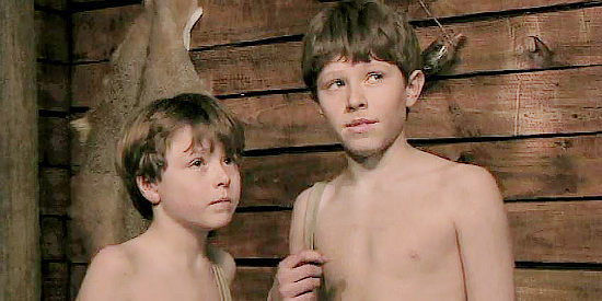 Jace Fletcher as Johnny Braswell and Justin Fletcher as Billy Braswell, the two orphans Canfield takes under his wing in The Showdown (2009)