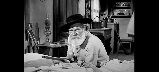 James Barton as Grandpa, ready for trouble after a falling out among Stretch's gang in Yellow Sky (1948)