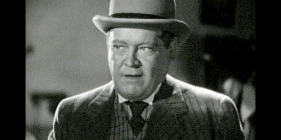 James Donlan as Kirby, manager of the Tiger Kid, pulling a trick to break his fighter free of Ruby Carter in Belle of the Nineties (1934)