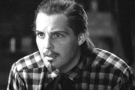 James Ellison as Buffalo Bill Cody, listening to Wild Bill explain the calamity faced by the cavalry in The Plainsman (1936)