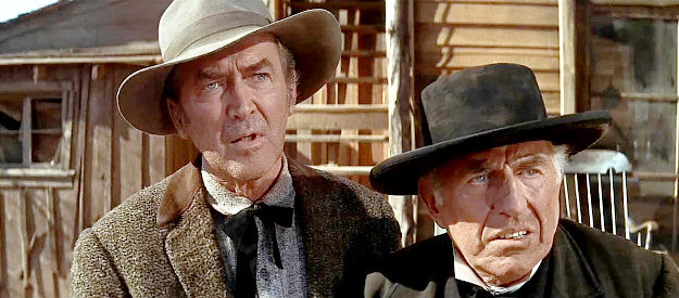 James Stewart as Johnny Cobb and Ed Begley as Preacher Broyles, reacting to the rude behavior of Larkin's men in Firecreek (1968)