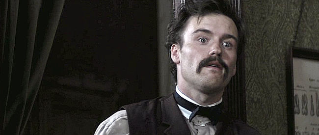 Jamie Thomas King as Doc Holliday, the dentist who pulls James' aching tooth in The Legend of Hell's Gate (2011)
