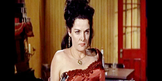 Jane Russell as Nona Williams, her dress tattered in an encounter with Mayor Jess Yates in Johnny Reno (1966)
