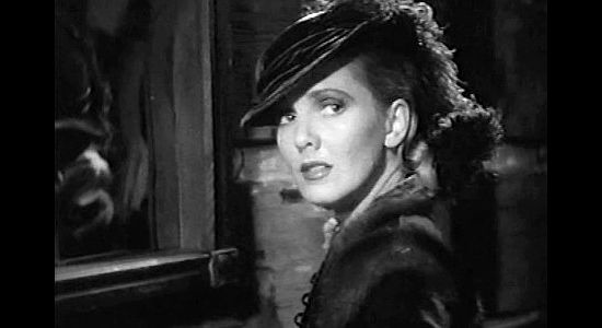 Jean Arthur as Calamity Jane, all dolled up and about to get an unwelcome visit from the Cheyenne in The Plainsman (1936)