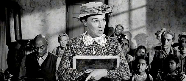 Jeanette Nolan as Nora Ericson, taking English lessons at Ransom Stoddard's school in The Man Who Shot Liberty Valance (1962)