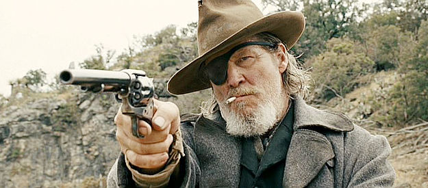 Jeff Bridges as Rooster Cogburn, trying to keep traveling partner LaBoeuf in line in True Grit (2010)