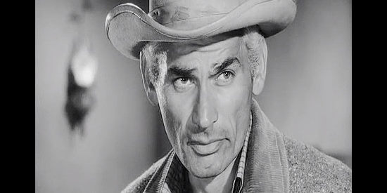 Jeff Chandler as Sam Christy, a maimed Civil War veteran inclined to mind his own business in The Plunderers (1960)