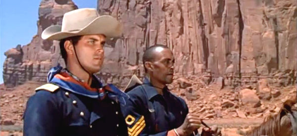 Jeffrey Hunter as Lt. Tom Cantrell and Woody Strode as Sgt. Rutledge, riding side by side in Sergeant Rutledge (1960)