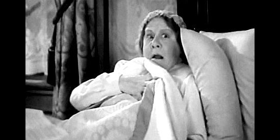 Jessie Ralph as Mrs. Brian, Nellie's mom, caught in bed and horrified to learn she'll remain under the watchful eye of 'Solitary' Carter in Yellow Dust (1936)