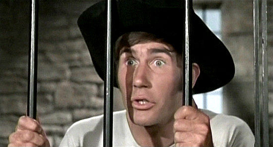 Jim Dale as Marshal P. Knutt, a sanition engineer turned marshal, locked in his own jail in Carry On Cowboy (1966)