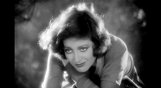 Joan Crawford as Joan 'Montana' Prescott, turning on the charm to snare Larry Kerrigan in Montana Moon (1930)