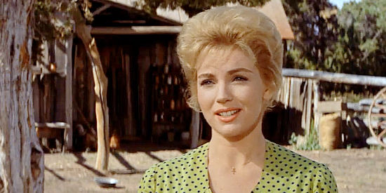 Joan O'Brien as Melinda Marshall, the woman who always looks forward to Jake's visits in The Comancheros (1961)