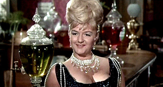 Joan Sims as Belle Armitage, figuring she's enough woman for The Rumpo Kid in Carry On Cowboy (1966)