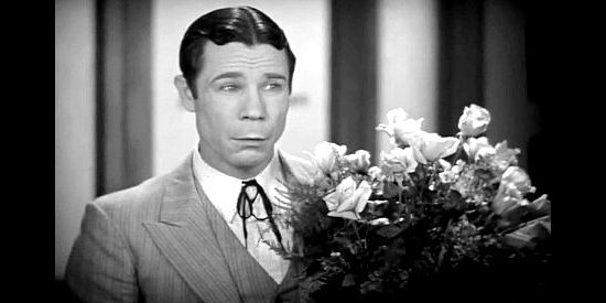 Joe E. Brown as Calvin Jones, sad upon learning that Ruth Weston plans to quit her job in The Tenderfoot (1932)