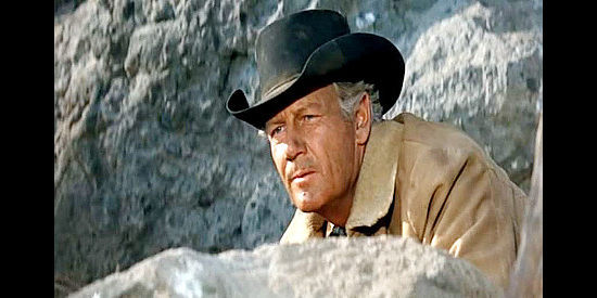 Joel McCrea as Steve Judd, pinned down during a shootout with the Hammond clan in Ride the High Country (1962)