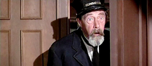 John Carradine as Ticker, a guard on the train, shocked to see his colleague tied and bound in The Good Guys and the Bad Guys (1969)