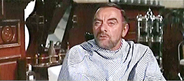 John Ireland as Dave, a barber shop client who shares news of Madero's death in Villa Rides (1968)