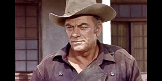 John Ireland as Tom Horn, a drifter who finds a purpose when he encounters a wagon train in trouble in Fort Utah (1967)