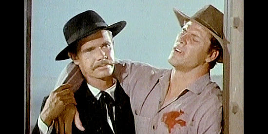 John Lupton as Jesse James looking for medical attention for wounded colleague Hank Tracy (Cal Bolder) in Jesse James Meets Frankenstein's Daughter (1966)