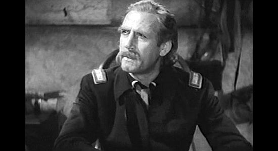 John Miljan as George Armstrong Custer, listening to Wild Bill Hickok's tale of Indian trouble in The Plainsman (1936)