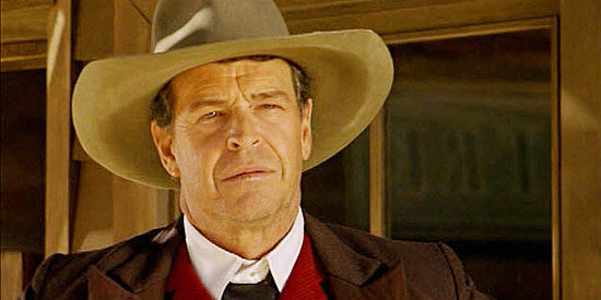 John Nobel as Fergus Hunter, the cattleman who wants Rebecca Yoder's land in The Outsider (2002)