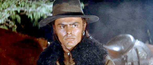 John Saxon as Johnny Portugal, the man who helps ride down Abe Kelsey in The Unforgiven (1960)