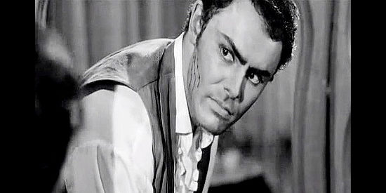 John Saxon as Rondo, inspecting the scratches Ellie Walters left on his face in The Plunderers (1960)