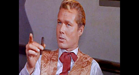 John Smith as Joe Gore, the man who runs the crooked saloon at the heat of Emporia's problems in Waco (1966)