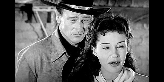 John Wayne as Quirt Evans with Gail Russell as Penelope Worth, fearing he's scared of a life with her in Angel and the Badman (1947)