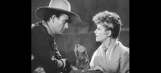 John Wayne as Ringo Kid proposes a future together to a surprised Dallas (Claire Trevor) in Stagecoach (1939)