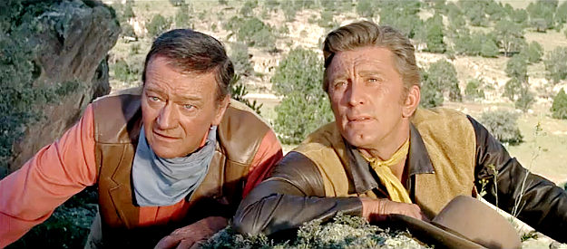 John Wayne as Taw Jackson and Kirk Douglas as Lomax, trying to locate Levi Walking Bear in The War Wagon (1967)