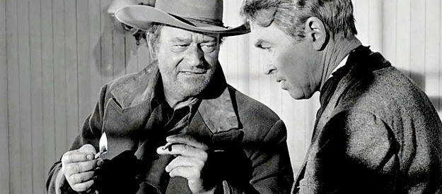 John Wayne as Tom Doniphon, sharing a secret about the night an outlaw died with Ransom Stoddard (James Stewart) in The Man Who Shot Liberty Valance (1962)